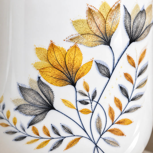 Close-up of the botanical floral print on the ceramic cup