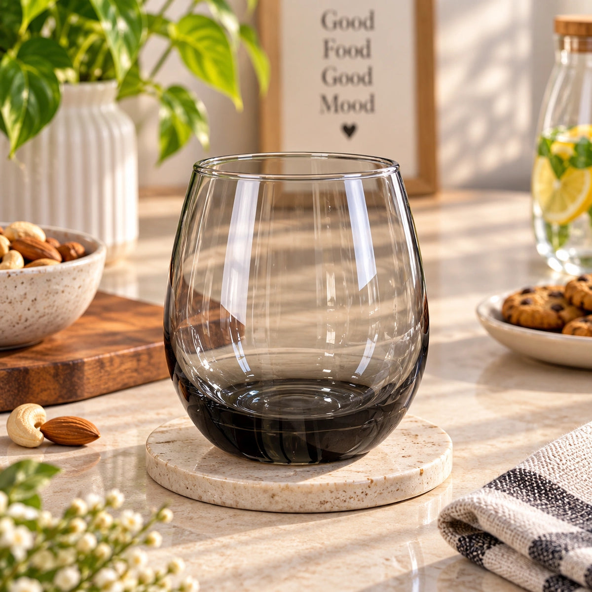 Smoky black stemless drinking glass with a charcoal tint