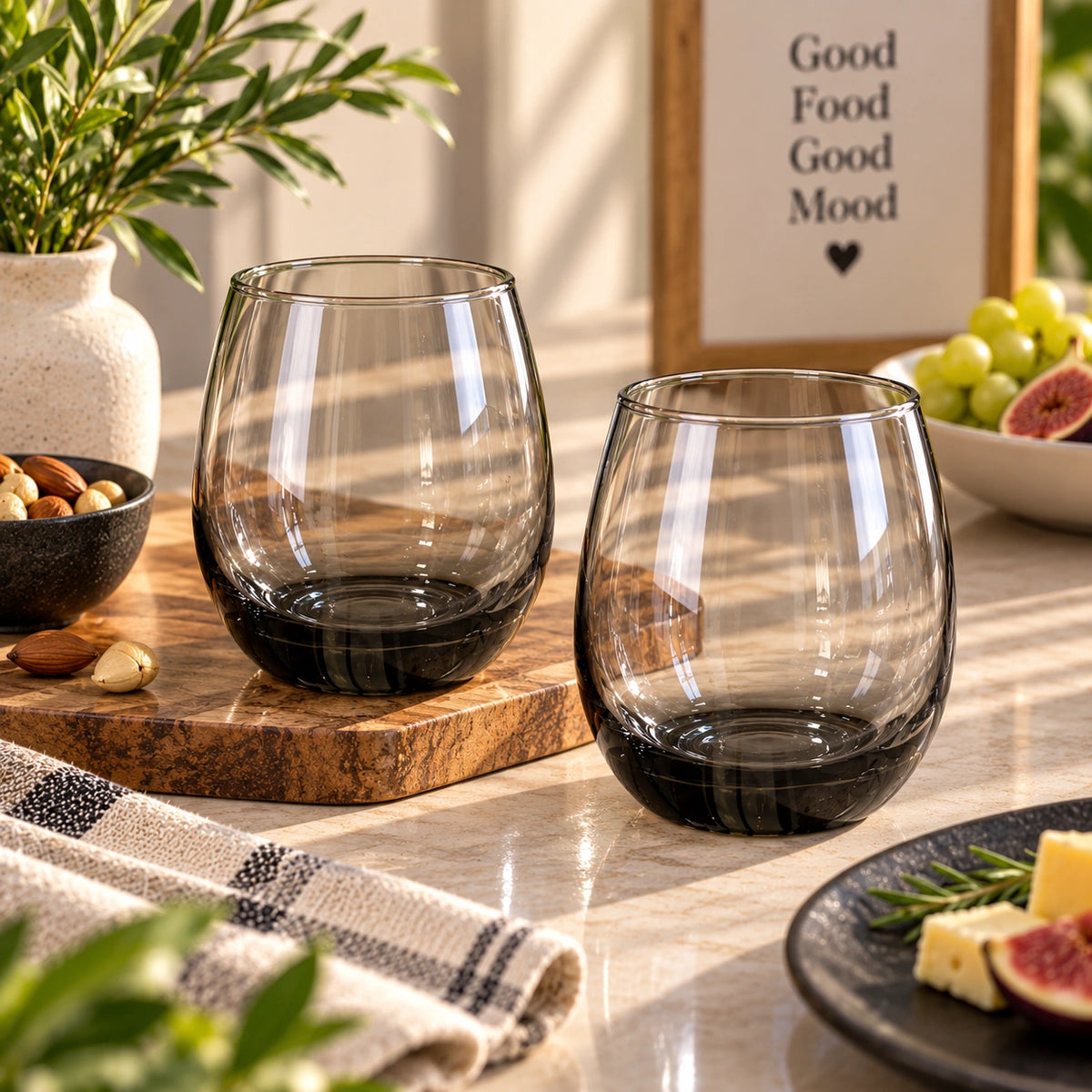 Smoky black stemless glass filled with a drink
