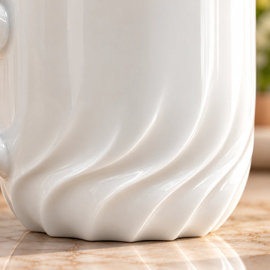 Close-up of the carved swirl texture on the white porcelain cup