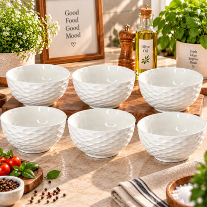 White wave textured ceramic bowls shown as a matching set