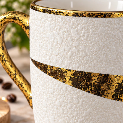 Gold Splatter textured ceramic mug shown from the side with its handle