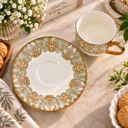 Close-up of the baroque gold floral design on the porcelain tea cup