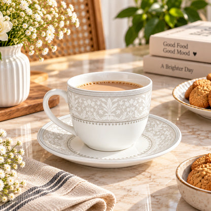 Silver Baroque floral tea cup and saucer set in porcelain with silver scrollwork