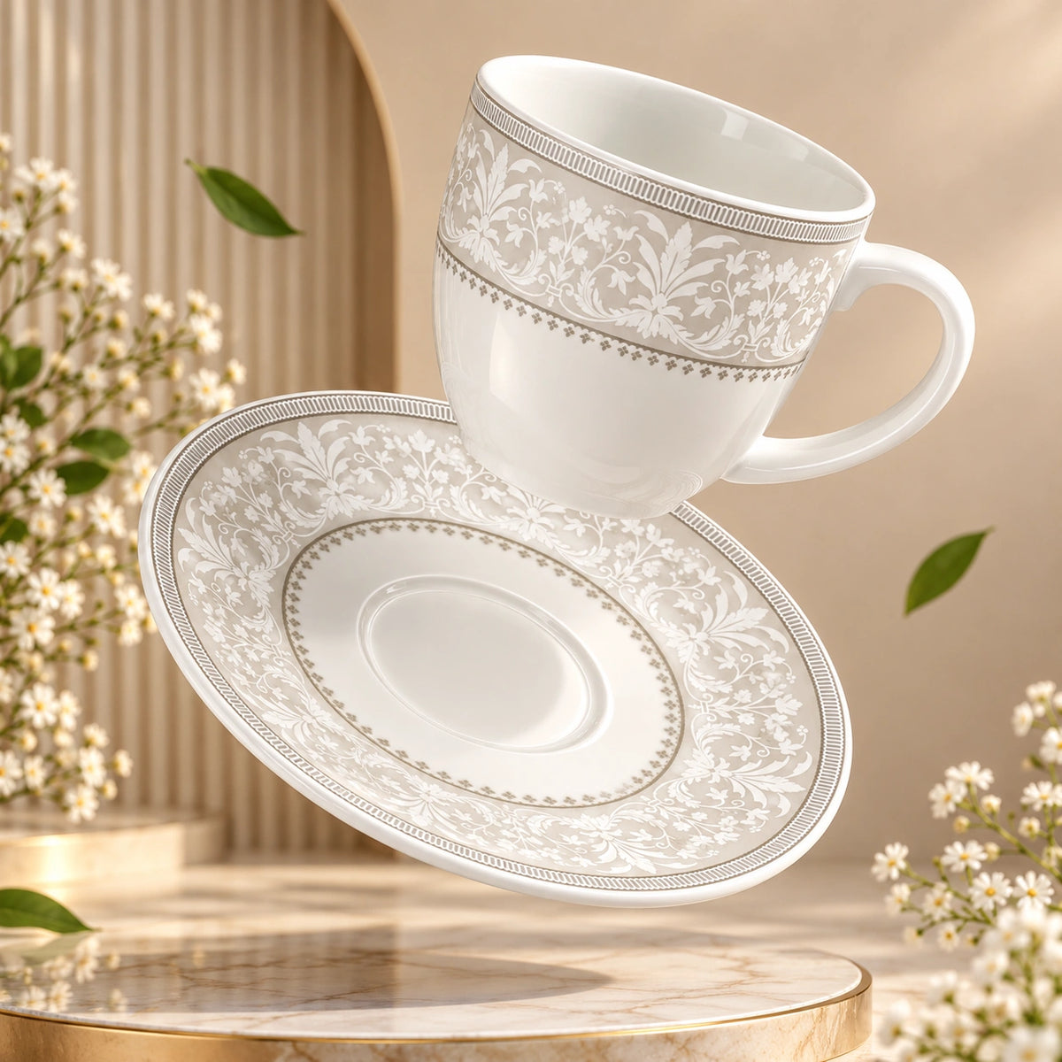 Silver Baroque floral tea cup and saucer shown as a full set