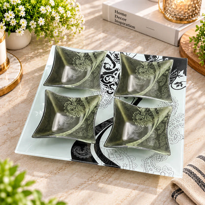 Close-up of the black and white paisley pattern on the glass serving tray