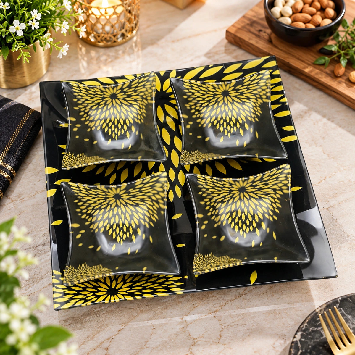 Close-up of the gold sunflower petal burst pattern on the glass tray