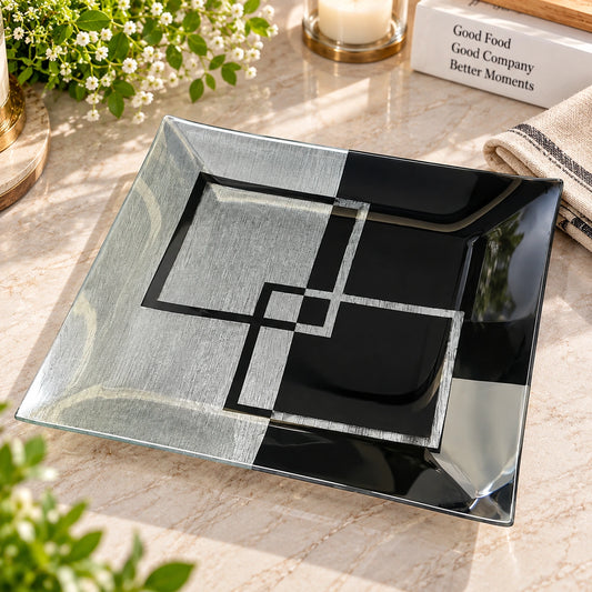 Close-up of the black and silver geometric Art Deco pattern on the glass tray