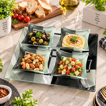 Black and silver geometric glass tray and bowls styled with snacks