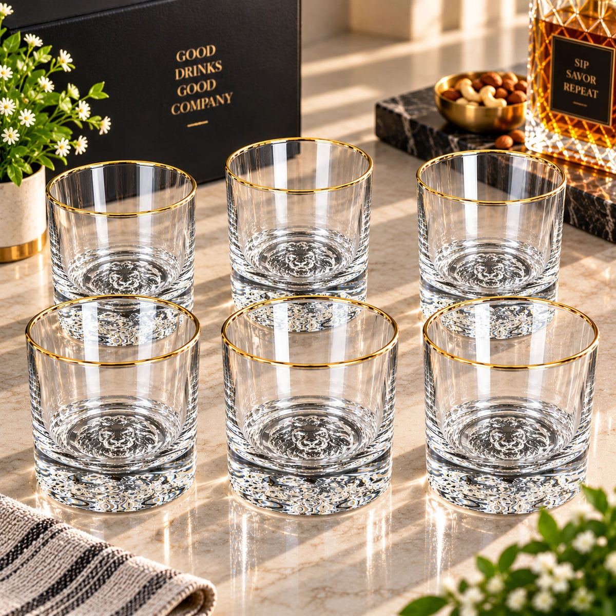 Lion Base gold rim crystal glasses shown as a matching set